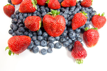 Fototapeta na wymiar Strawberries and blueberries on white