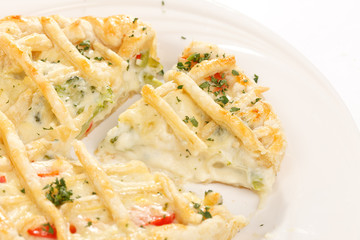tasty quiche with cheese and herbs