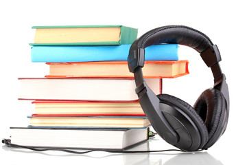 Obraz na płótnie Canvas Headphones on books isolated on white