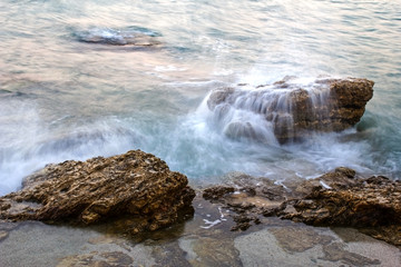 Fototapeta na wymiar Stones and waves