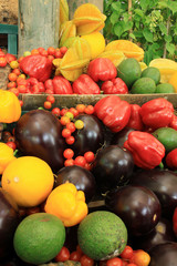 Photo of a large group of fruit and vegetables on straw