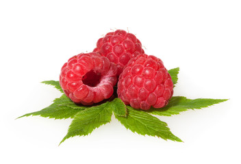 Raspberries isolated on white background with leaves