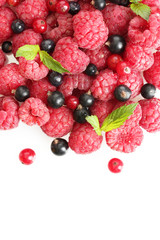 ripe berries with mint, isolated on white.