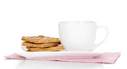 Cup of tea and cookies isolated on white