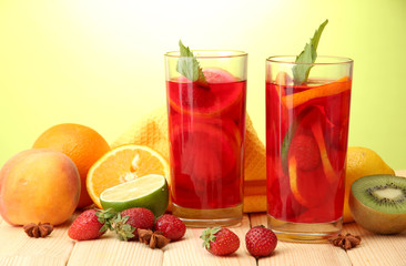 Fototapeta na wymiar Refreshing sangria in glasses with fruits,