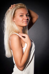 Fototapeta premium Studio portrait of beautiful girl on the black background