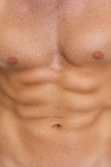 Naklejka premium Closeup on abdominal muscles