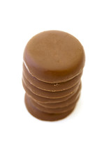 Few chocolate pieces on white background