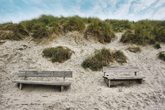Two Wooden benches at the seaside