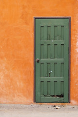 The green door and orange wall