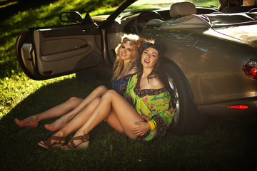 Two women next to the car