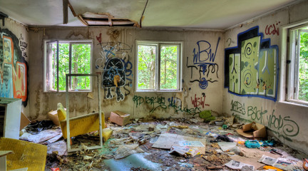 Adandoned trashed house with graffifi on walls