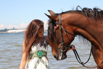 Obraz premium Girl with brown horse