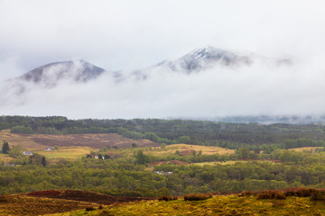 Landscape with mist covered mountains