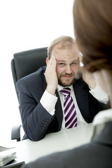 Fototapeta premium beard business man brunette woman at desk headache