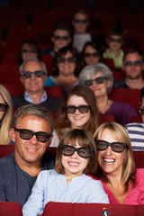 Obraz premium Family Watching 3D Film In Cinema