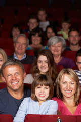 Family Watching Film In Cinema © Monkey Business
