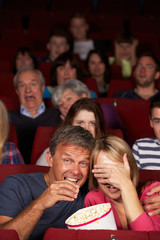 Couple Watching Film In Cinema