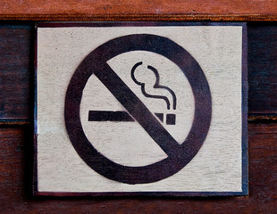 The Sign of no smoking  on wood background