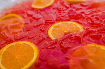slices of orange in pink punch