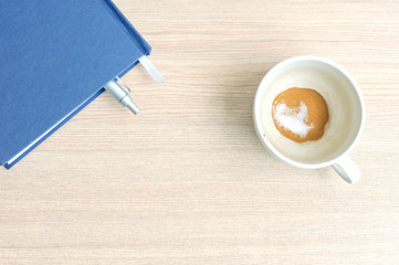 Coffee cup on a wooden table