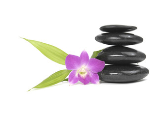 Zen pebbles balance. Orchid and bamboo leaf