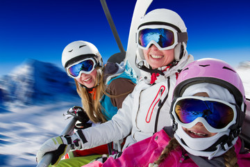 Skiing, winter  - happy family ski team on ski lift