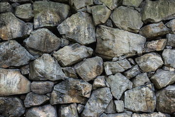 Wall of rough stone blocks
