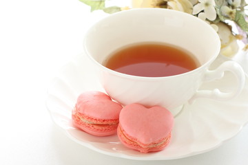 heart shaped macaron and English tea with copy space