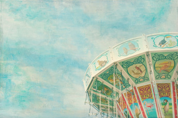 Closeup of a colorful carousel with painterly textured editing