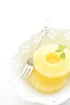 slices of pineapple for dessert image