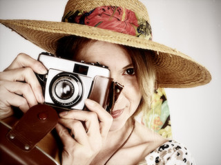 smiling woman with old analog camera
