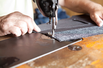 Fototapeta na wymiar sewing fabric with the sewing machine