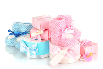 baby boots, pacifier, gifts and blank postcard  isolated