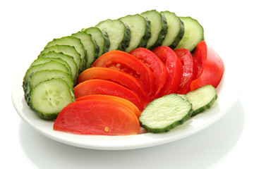 slised vegetables on plate, isolated on white