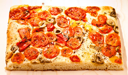 focaccia with tomatoes, olives, artichokes and vegetables