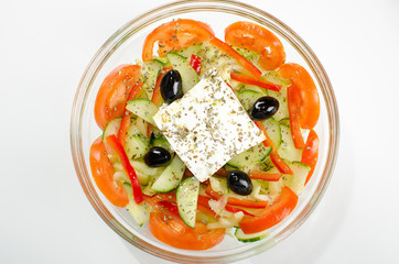Mediterranean salad on transparent bowl