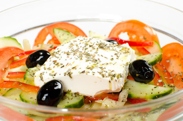 Mediterranean salad on transparent bowl