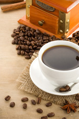 cup of coffee and beans on wood