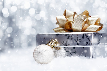 Christmas gift in falling snow