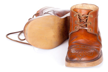 Red old leather boots isolated on white background
