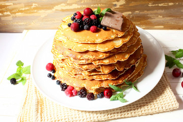 Pancakes with berries and chocolate