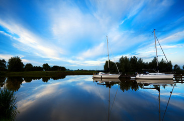 two yachts on blue river