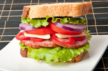 Healthy ham sandwich with cheese, tomatoes and lettuce