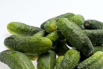 A fresh green cucumber isolated on a white background