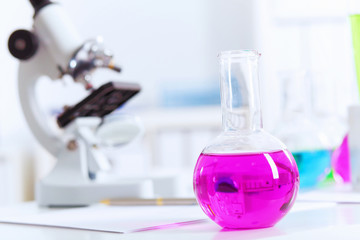 Chemistry laboratory glassware with colour liquids