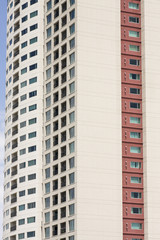 Beige and Red Condo Tower with Balconies