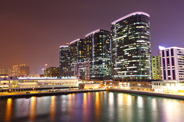 office buildings at sea coast at night