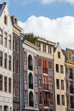 Row of old and modern canal houses in Amsterdam