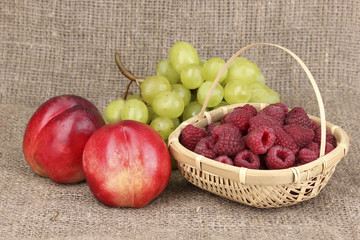 ripe sweet fruits and berries on sackcloth